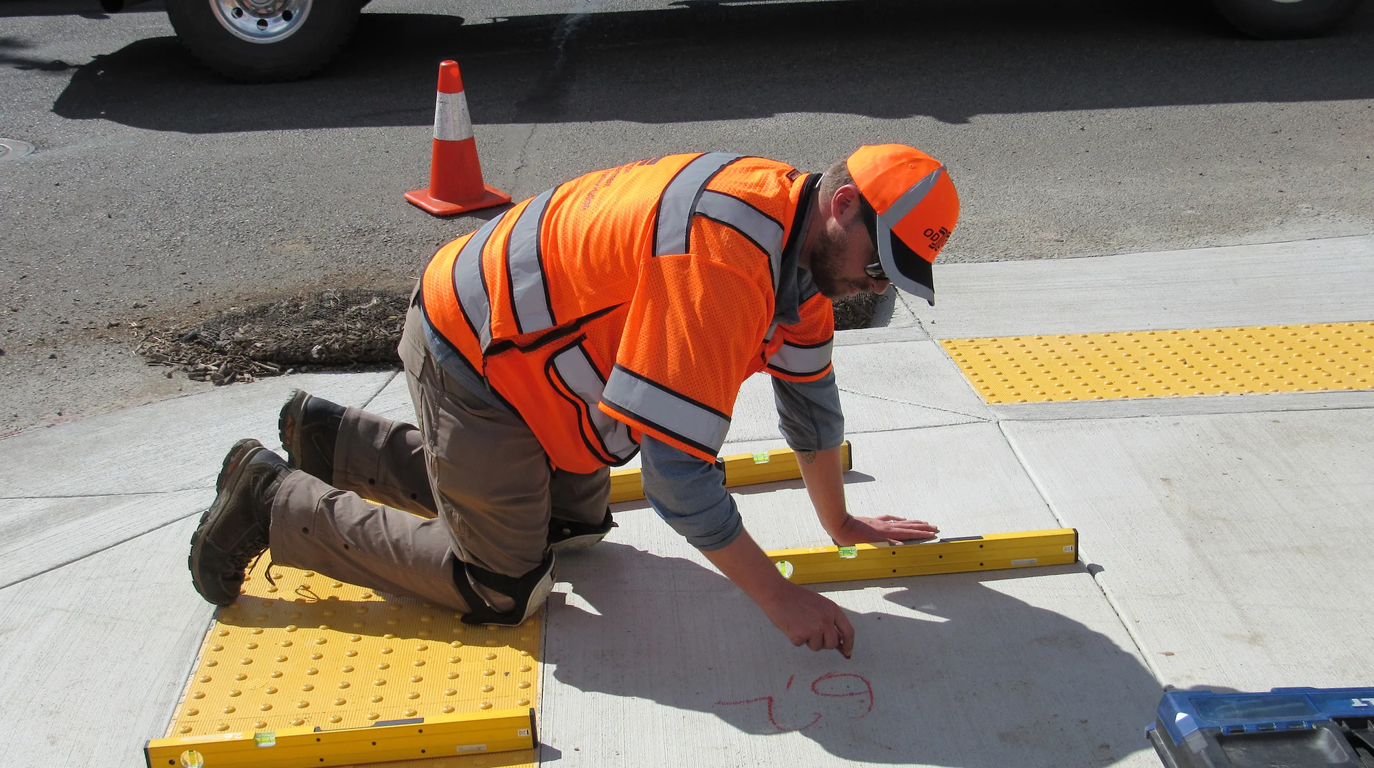 worker renovating a sidewalk